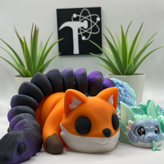 Decorative wall art with a fox figure, plants, and a logo on a white background